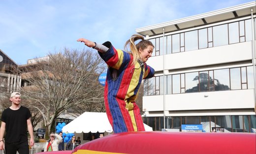 Student enjoying activity at Massey Open Day event.